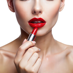 Naklejka premium Woman applying red lipstick, focusing on her lips