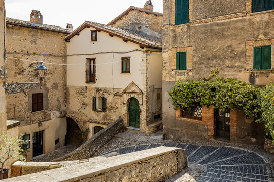 A glimpse of the ancient medieval village of Casperia, in the province of Rieti, Italy. The old stone and brick buildings and cobblestone streets.