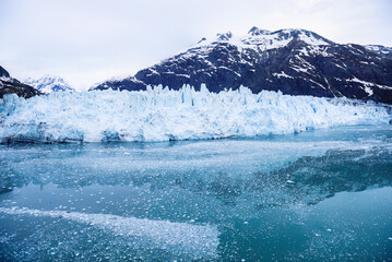 Fototapeta premium Glacier and mountains reflected in cold waters at Glacier Bay National Park and Preserve. Alaska.