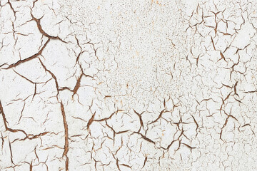 Texture of damaged and cracked concrete wall.