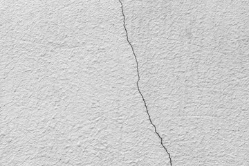 Texture of damaged and cracked concrete wall.