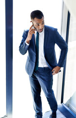 Black man, connection and phone call at office in communication, networking or business. Male person, mobile and work as insurance agent for company, financial firm or corporate for future investment