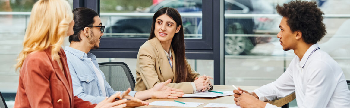 Intense job interview session filled with job seekers and interviewers around a table in an office.