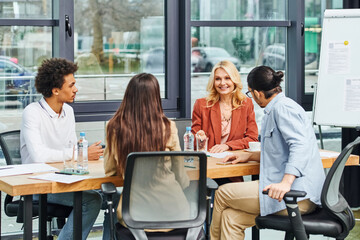 Group of professionals discussing in a conference room at the office.