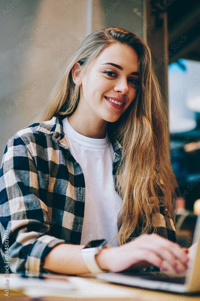 Aufkleber portrait of cheerful female programmer enjoying time with laptop computer and distance job while sit