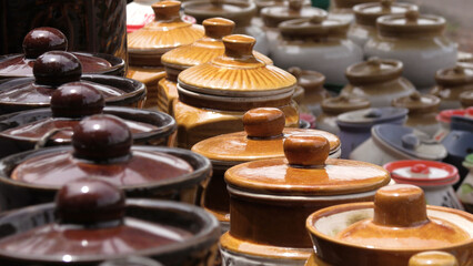 Colorful ceramic crockery items displayed in a shop
