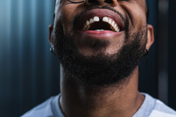 Black man, mouth closeup and teeth with smile for hygiene, gum health and orthodontics. African girl, tooth zoom and and dental wellness for veneers and fresh breath