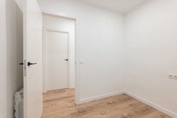Tranquil minimalist empty room with open doors and wooden flooring, modern clean design