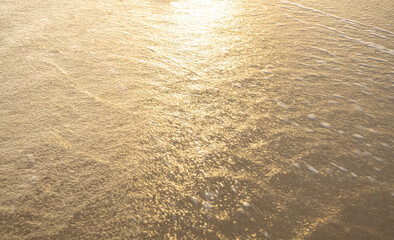 Reflections of the sun in the water of the sea. abstract tropical sunset.