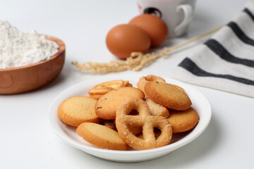 butter cookies. Cheese butter cookies on a white plate. Perfect for recipe, article, catalogue, or any commercial purposes. With copy space.