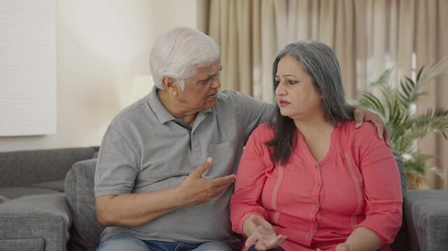 Indian old couple talking to each other
