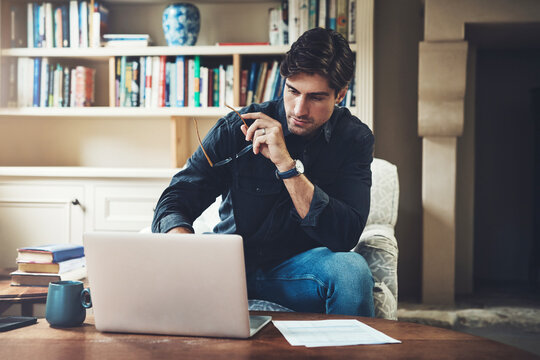 Document, laptop and man with stress on sofa for loan payment, financial bills and home insurance. Frustrated, person and thinking with tech by paper for mortgage debt, invoice and repayment on table