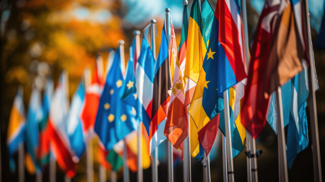 A vibrant display of various international flags lined up outdoors, representing global unity and diversity.