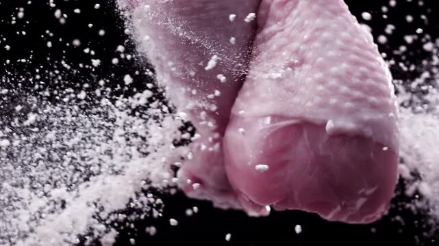Chicken drumsticks flying in the air . Super Slow-motion 1000fps