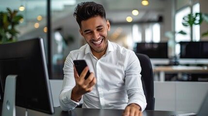 Businessman using smartphone in modern office, smiling