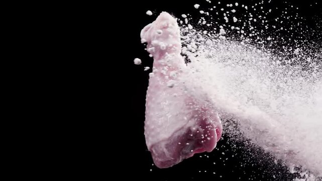 Chicken drumsticks flying in the air . Super Slow-motion 1000fps