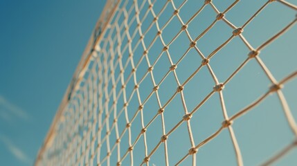 Close-Up View of Netting Against a Bright Blue Sky Background with Knots and Texture