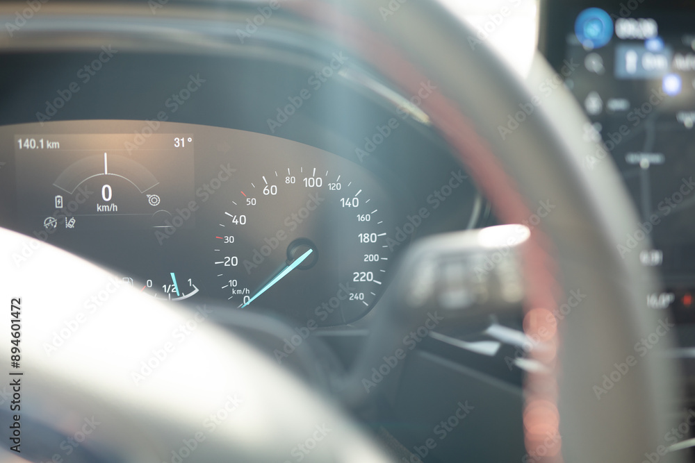 Poster a car s dashboard with a speedometer reading zero