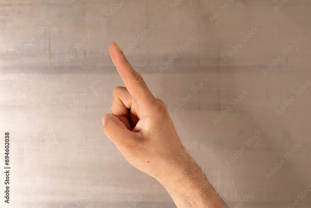 Poster a hand points upwards with a single finger