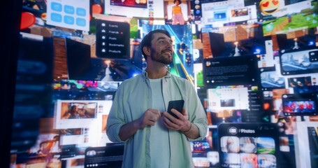 Obraz premium Portrait Of Caucasian Man Using Smartphone in 3D Cyberspace With Animated Social Media Interfaces, Online Games, Videos, and Internet Content. Visualization Of Male Enthusiast Surfing the Web Network.