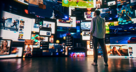 Back View Of Caucasian Man Enjoying 3D Cyberspace With Animated Social Media Interfaces, Online Video Games, Viral Videos, Internet Content. Visualization Of Male Enthusiast Surfing Computer Network.