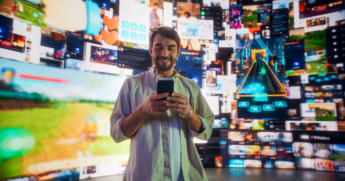 Portrait Of Caucasian Man Using Smartphone in 3D Cyberspace With Animated Social Media Interfaces, Online Video Games, Viral Videos, Internet Content. Visualization Of Blockchain Technology Concept. - Powered by Adobe