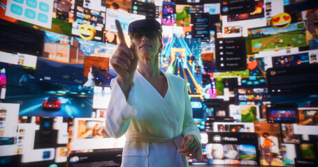 Portrait Of Caucasian Woman Wearing Augmented Reality Glasses And Surfing 3D Cyberspace With Gestures: AR Browsing Through Websites, Watching Videos, Using Social Media, Doing e-Commerce Shopping.