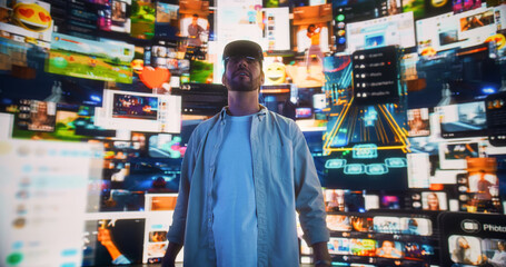Portrait Of Caucasian Man Wearing Augmented Reality Glasses And Surfing Cyberspace Interface. Male Using Gestures To Browse Content, Watch Video Streaming, Social Media Influencers In AR.