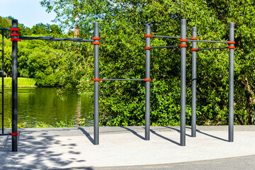 sports ground for workout in the park.  workout area without people. sports ground with horizontal bars.