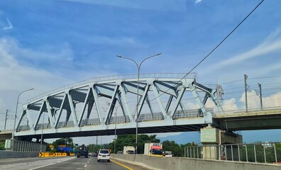 Naklejka premium West Bandung, Indonesia on December 12, 2023. The KCIC Padalarang Steel Bridge