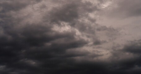 Dramatic dark storm thundercloud rain clouds on black sky background. Dark thunderstorm clouds rainny landscape. Meteorology danger windstorm disaster climate. Dark cloudscape storm disaster gray sky