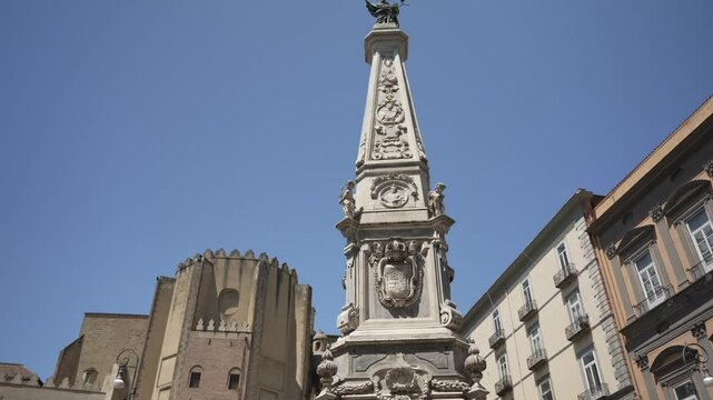 View of Obelisco di San Domenico and cafes in Piazza San Domenico Maggiore, UNESCO World Heritage Site, Naples, Campania, Italy