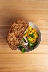 Healthy Breakfast with Scrambled Eggs Salad and Bread