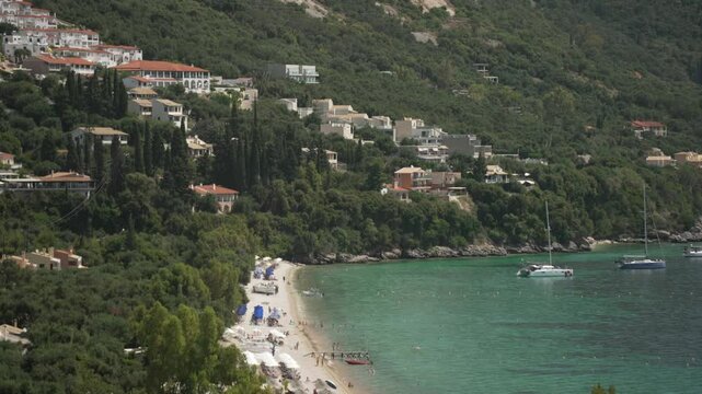 View of Ionian Sea and Paralia Mparmpati beach with hills in the background, Barbati, Corfu, The Ionian Islands, Greek Islands, Greece