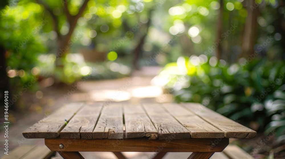 Poster a wooden picnic table sits in a forest, with sunlight filtering through the trees.