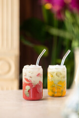 Passion fruit and strawberry iced drink. Summer cold drink. Vegetarian drink. Selective focus.