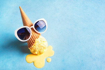 Melting ice cream cone and sunglasses