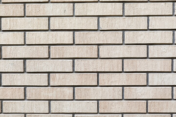 Yellow and textured brick wall background	
