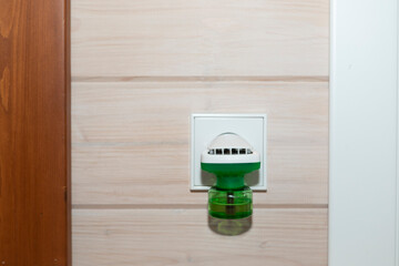 Close-up of fumigator works at home. Useful device against insects	
