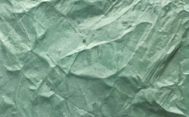 Fototapeta premium abstract background, wrinkled jade color textured paper