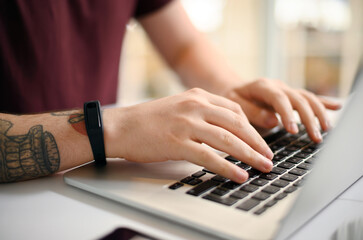 Business, hands and typing on laptop at desk with copywriting, blog post review and email feedback....