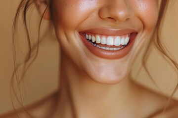 Bright and cheerful portrait of a woman showcasing a radiant smile against a warm background.
