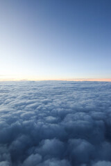 sky with thick cloud and blue sky with slight light from the left taken on the plane suitable for wallpaper