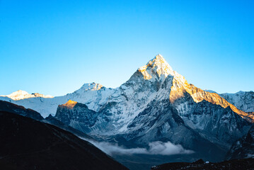The sunrise of Ama Dablam with golden light at EBC trip in Nepal