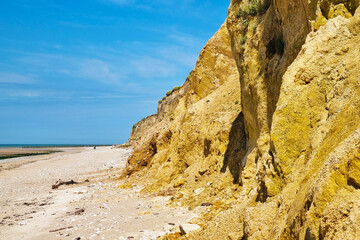 Scenic Coastal Cliffs Under Blue Sky - Perfect for Travel and Tourism Posters