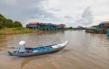 Fototapeta premium Tonle Sap lake, Siem reap Province, Cambodia. Fisherman in his boat, Floating village of Kompong Phluk, Cambodia.