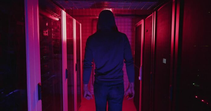 Man in Dark Room With Red Lights