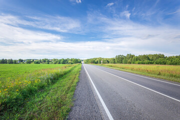 Fototapeta premium A road with a clear blue sky above it