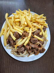french fries and meat on plate