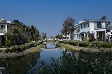 Obraz premium Canals of Venice in California with amazing houses, boats, palm trees on the shore